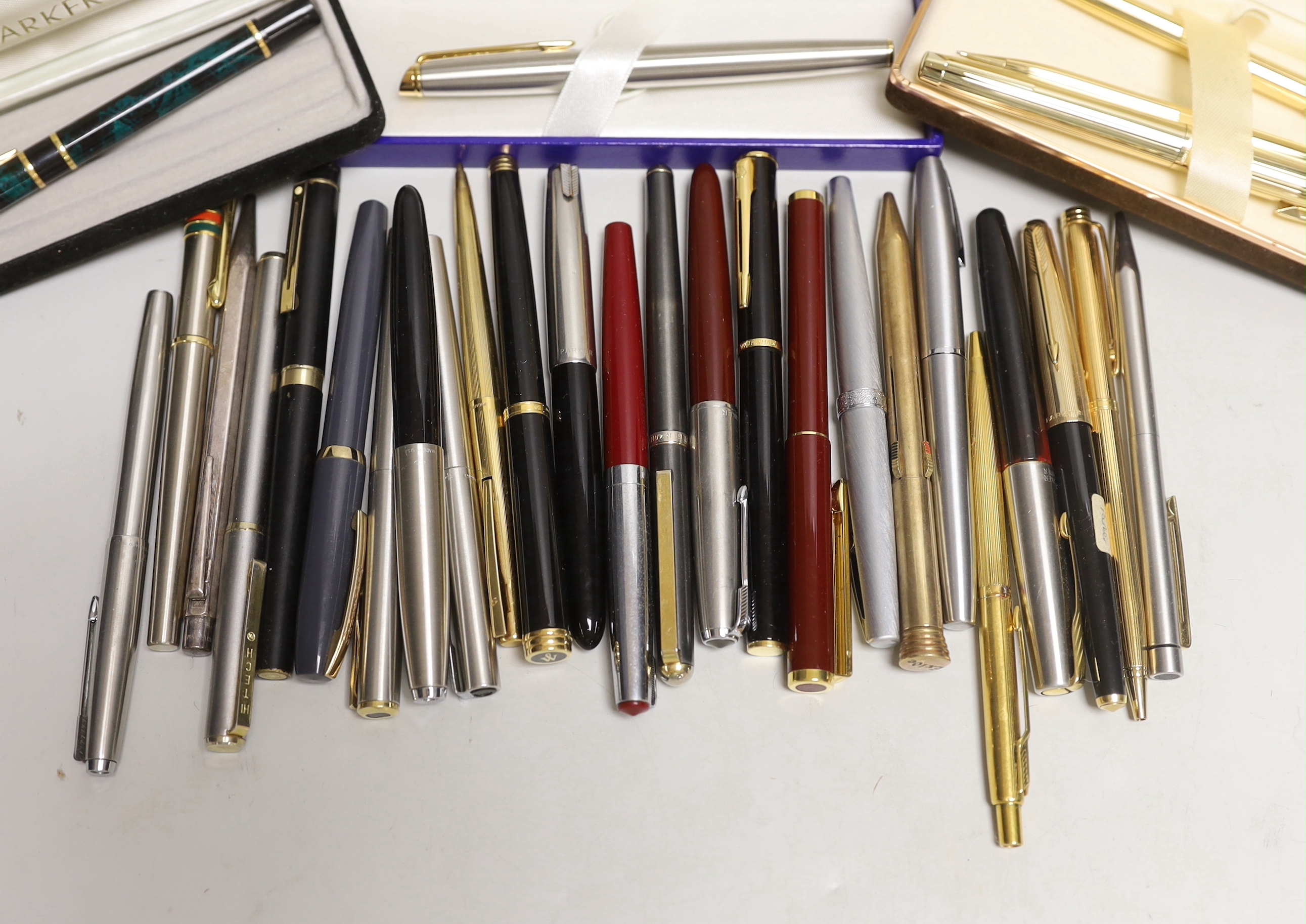 A group of fountain pens and ballpoint pens including a cased Sheaffer set